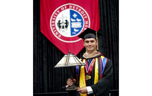 Mark Formosa holding award